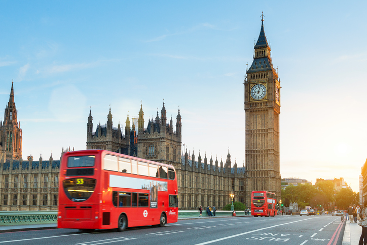 London, United Kingdom - August 20, 2016: Westminster palace and Big Ben and traffic on Westminster bridge in foreground